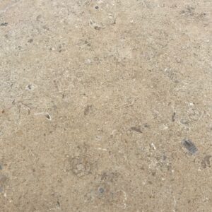 Hamlet tumbled and brushed limestone